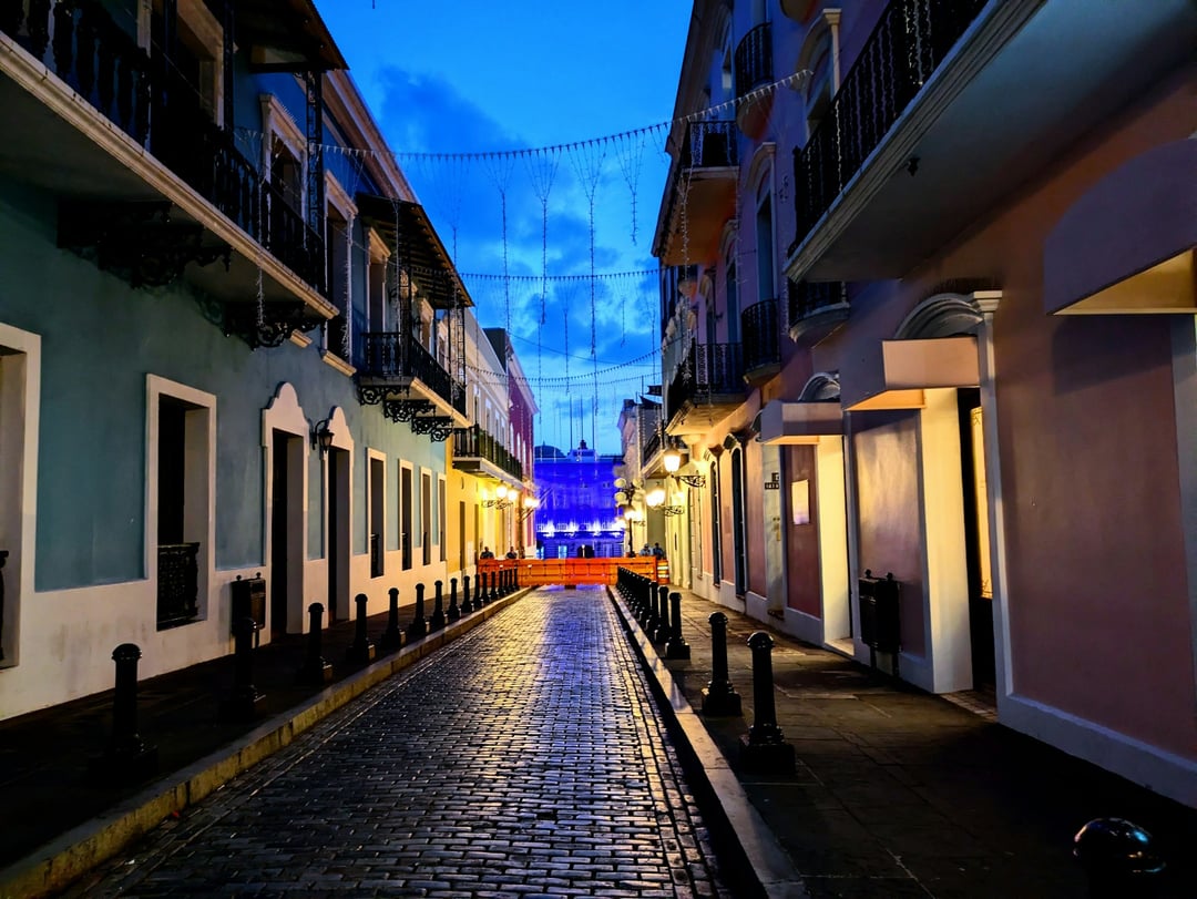 Cobblestone streets and colorful buildings in Old San Juan at night, Puerto Rico